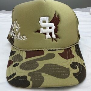 Stevenson Ranch “Not My First Rodeo” Camo Trucker Hat with Embroidered Design